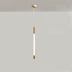 Pendant light with a sleek gold finish and white illuminated center, displayed against a plain white studio background.