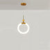 Modern pendant light featuring a sleek gold finish with a circular white LED design, set against a plain white studio backgro