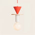 Pixie Pendant Light features a red cone top with a wood disk, white cylindrical base, and a frosted bulb, set against a plain