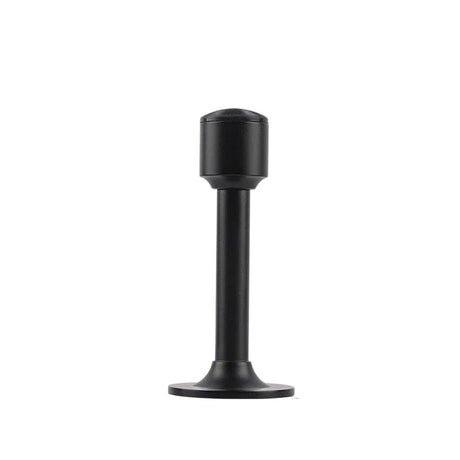 "Sculpted brass door stop with a sleek, tapered silhouette, matte black polished finish, wide stable base, and magnetic hold, designed to prevent wall damage."