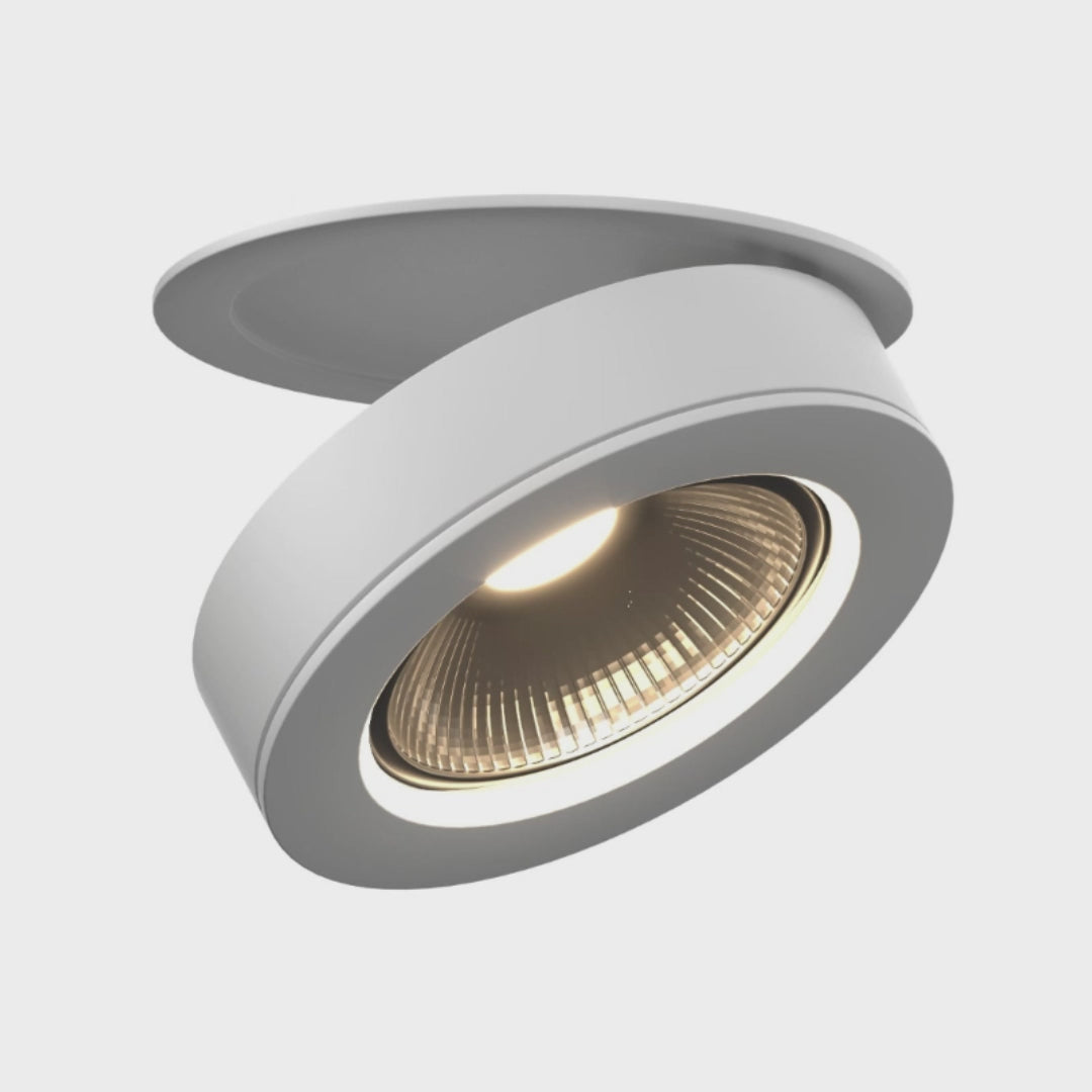 Simon Downlight - Industrial 360° Rotatable Lighting Fixture emitting warm light, designed for semi-recessed ceiling installation in modern interiors.