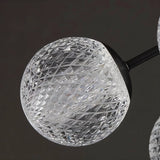 "Detailed view of the textured acrylic diffuser on a starburst chandelier."