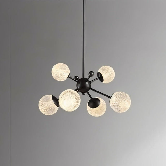 "Starburst chandelier with iron arms and textured acrylic diffusers, featuring six lights against a gray background."
