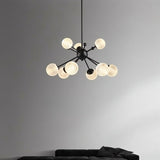 "Starburst chandelier with iron arms and textured acrylic diffusers, featuring eight lights, hanging above a living room sofa."