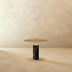 Concrete cylinder pedestal table with 13-inch round top, white studio background, front view