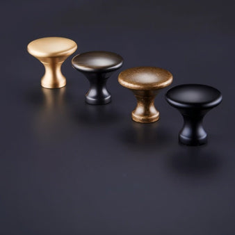 "Dome-shaped brass cabinet knobs with flared bases in various finishes, suitable for modern, transitional, and vintage interiors."