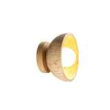 "Modern travertine wall lamp with a circular wooden backplate, showcasing its unique design and natural materials."