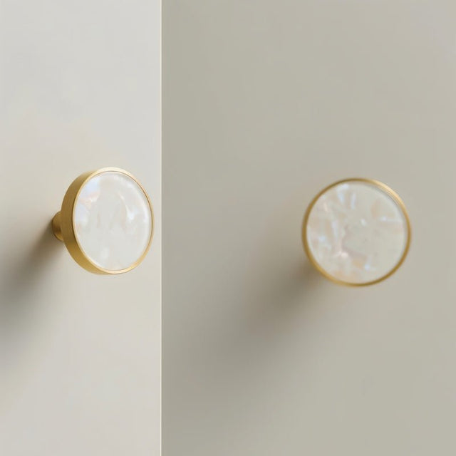 "Brass knobs with pearl shell inlays, adding a touch of modern elegance to cabinet doors."