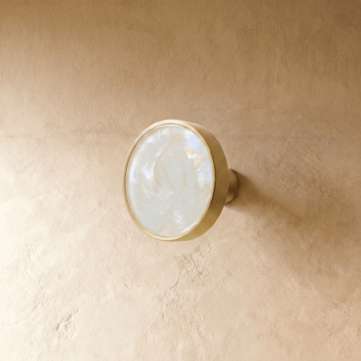 "Modern luxury brass knobs and pull bars with shell inlays, featuring pearl and abstract textures for contemporary interiors."