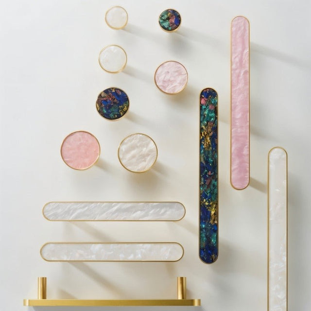 "Brass knobs and pull bars with intricate shell inlays, adding a touch of modern elegance to cabinets and drawers."