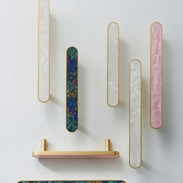 "Modern brass pull bars with intricate shell inlays, adding a touch of luxury to contemporary cabinets and drawers."