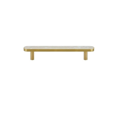 "Flat lay of a modern brass pull bar with a white shell inlay, isolated on a white background."