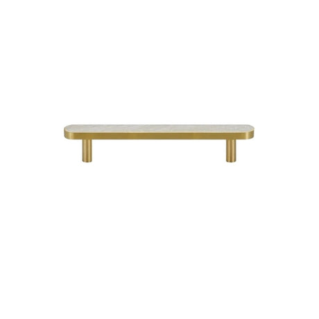 "A modern brass pull bar with a white shell inlay, isolated on a white background."