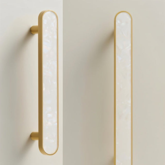 "Modern white shell inlay pull bars with brass frames, adding a touch of elegance to contemporary cabinets and drawers."