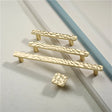 "Modern hammered texture cabinet knobs and pull bar handles with a polished finish."