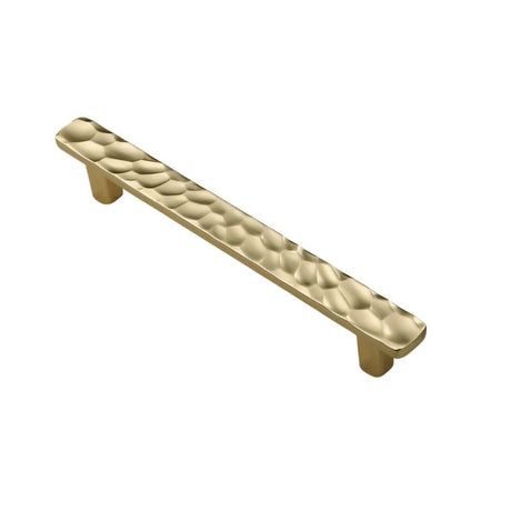 "Angled view of a gold hammered texture pull bar handle, showcasing its modern and artisanal design."