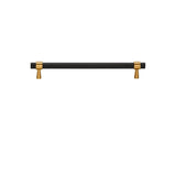 "A sleek black pull bar handle with gold accents on the mounts."