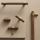 "Set of precision-crafted brass knurled pull bar handles with a cylindrical shape and sleek metallic finish."