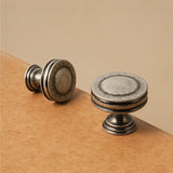 "A vintage-inspired antique brass knob with layered ridges, suitable for classic and rustic interiors."
