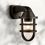 "A black, industrial-style wall lamp with a robust cage structure and clear PC diffuser, combining rugged design with contemporary elegance for indoor and outdoor spaces."