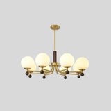 "Isolated Ralie chandelier with iron, wood, and frosted glass globes, centered on a light grey background."