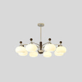 "Isolated Ralie chandelier with silver iron, wood, and frosted glass globes, centered on a light grey background."