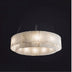 Alabaster chandelier with cylindrical shade and warm LED lighting suspended against black background.