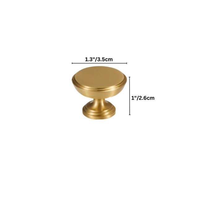 Dimensions of a solid brass cabinet knob with a cylindrical design and machined detailing, shown with measurements in inches and centimeters."