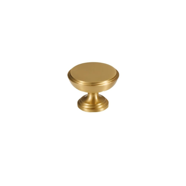 "A single solid brass cabinet knob with a cylindrical design and machined detailing, isolated on a white background."