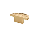 "A hammered brass half-circle knob with a textured, artisanal design, ideal for cabinetry and drawers."