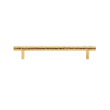 "A hammered brass pull bar with a textured, artisanal design, suitable for cabinetry and doors."