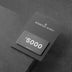 Gray gift card for Residence Supply displayed in packaging on dark textured background.