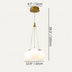 Brass and frosted glass triple globe pendant light against a neutral beige background.