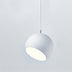 White spherical pendant light with tilted opening, suspended against neutral background.