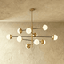 Modern satin brass molecular chandelier with six spheres on white background, front view showing dimensions.