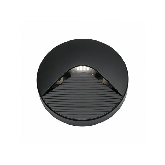 "A sleek, round step light with a minimalist design, featuring a durable plastic body and clear acrylic diffuser, providing a soft, focused downward glow for indoor and outdoor spaces."