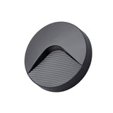 "A sleek, round, minimalist lighting fixture with a clear acrylic diffuser, designed for both indoor and outdoor spaces, providing a soft, focused downward glow."