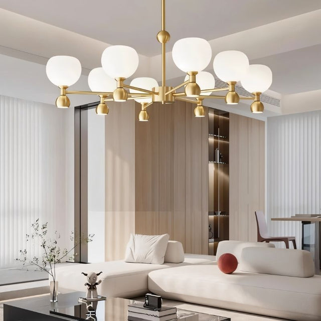 "An 8-light gold sputnik chandelier with frosted glass globes, hanging in a modern living room."