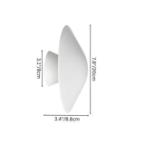 Dimensions of the Rochi Wall Lamp in white aluminum, featuring a sculptural design with measurements of 7.8 inches by 3.4 inches.