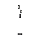 "A black modern floor lamp with layered acrylic shades and a marble base."