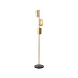 "A gold modern floor lamp with layered acrylic shades and a marble base."