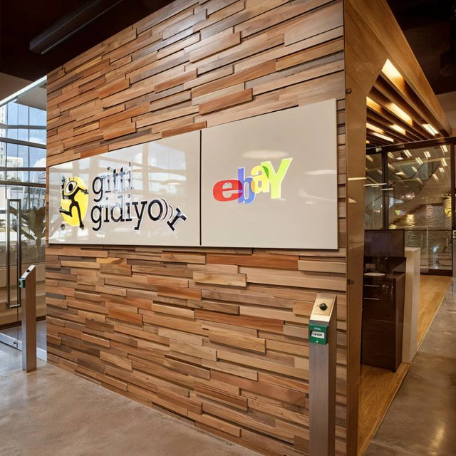 Ronus Decorative Panel - Modern, Acoustic-Enhancing Design used in a commercial office space with branded signage, blending style and function.