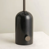 "Close-up of black marble base with metal accents, polished and sturdy design, modern and minimalist lighting"