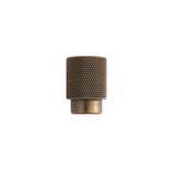 "Small knurled antique brass knob with a cylindrical grip and clean edges, suitable for modern cabinetry and drawers."