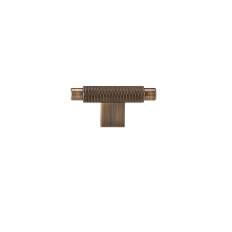 "A knurled antique brass knob with a cylindrical grip and clean edges, suitable for modern cabinetry and drawers."