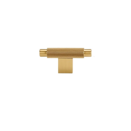 "A knurled gold brass knob with a cylindrical grip and clean edges, suitable for modern cabinetry and drawers."