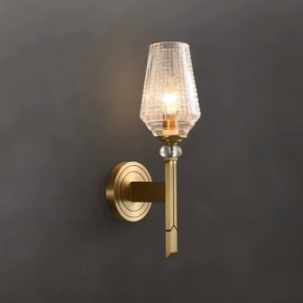 "Modern wall lamp with a copper base, gold finish, and textured glass shade for a soft, elegant glow."