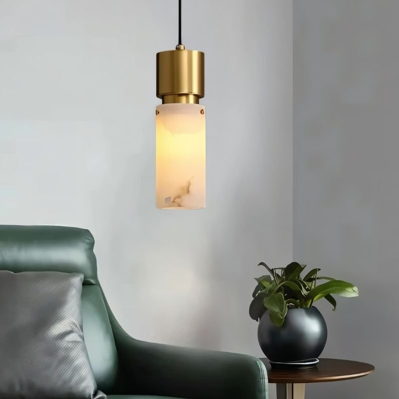 "Modern pendant light with alabaster shade and copper accents, illuminating a contemporary living room."