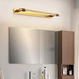 "A modern gold wall lamp with a sleek, adjustable cylindrical light bar mounted above a rectangular mirror in a contemporary bathroom."