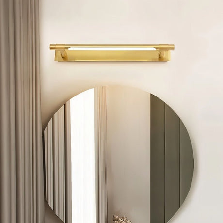 "A modern gold wall lamp with a sleek, adjustable cylindrical light bar mounted above a round mirror in a contemporary bathroom."